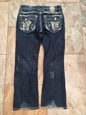 Rock Revival Dark Blue Distressed Jeans with Fleur Dis lis